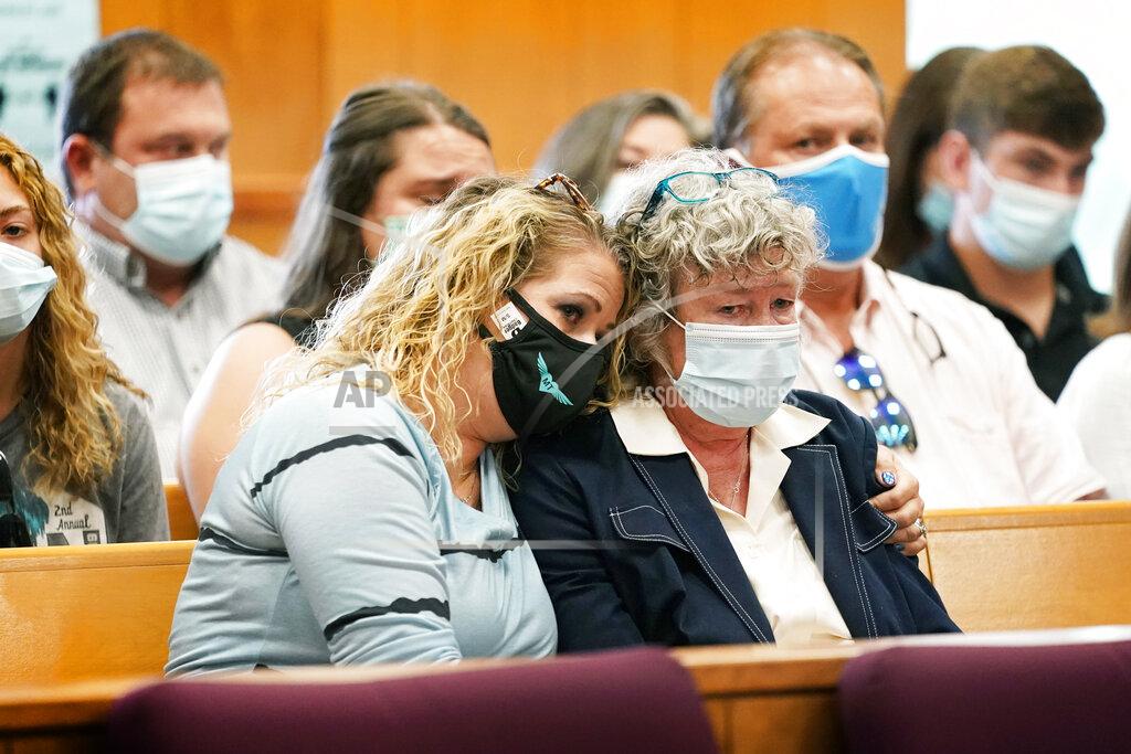 Charlie Neibergall Laura Calderwood, mother of Mollie Tibbetts, right, is comforted as her victim impact statement is read during a sentencing hearing for Cristhian Bahena Rivera, Monday, Aug. 30, 2021, at the Poweshiek County Courthouse in Montezuma, Iowa. Rivera was sentenced to life in prison for the stabbing death of college student Mollie Tibbetts, who was abducted as she was out for a run near her small eastern Iowa hometown in July of 2018. (AP Photo/Charlie Neibergall, pool)