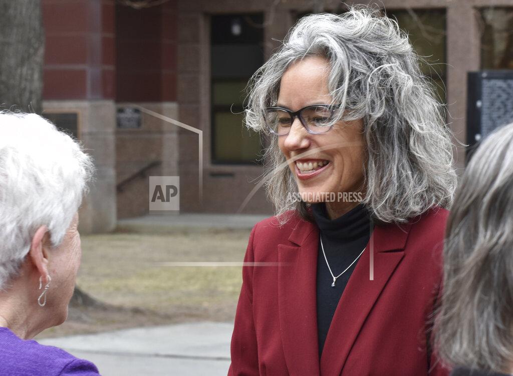 Matthew Brown FILE - In this April 5, 2019, file photo, former state Rep. Kathleen Williams, right, smiles to a supporter at a rally in Billings, Mont. Williams faces state Auditor Matt Rosendale the contest for Montana's sole seat in the U.S. House. (AP Photo/Matthew Brown, File)