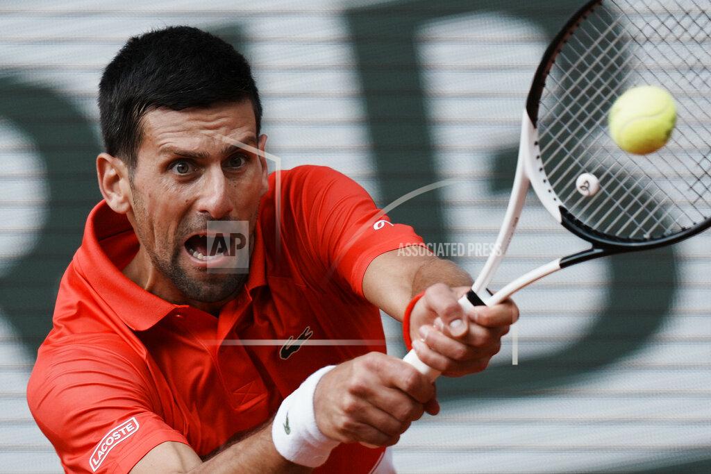 Thibault Camus Serbia's Novak Djokovic returns the ball to Slovenia's Aljaz Bedene during their third round match of the French Open tennis tournament at the Roland Garros stadium Friday, May 27, 2022 in Paris. (AP Photo/Thibault Camus)