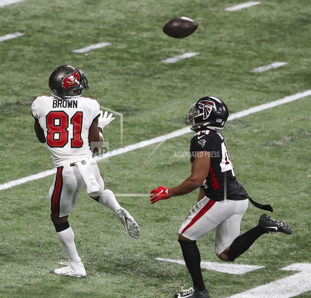 Curtis Compton Tampa Bay Buccaneers wide receiver Antonio Brown, left, gets past Atlanta Falcons cornerback Tyler Hall for what proved to be the winning touchdown in the final minutes of an NFL football game Sunday, Dec. 20, 2020, in Atlanta. (Curtis Compton/Atlanta Journal-Constitution via AP)