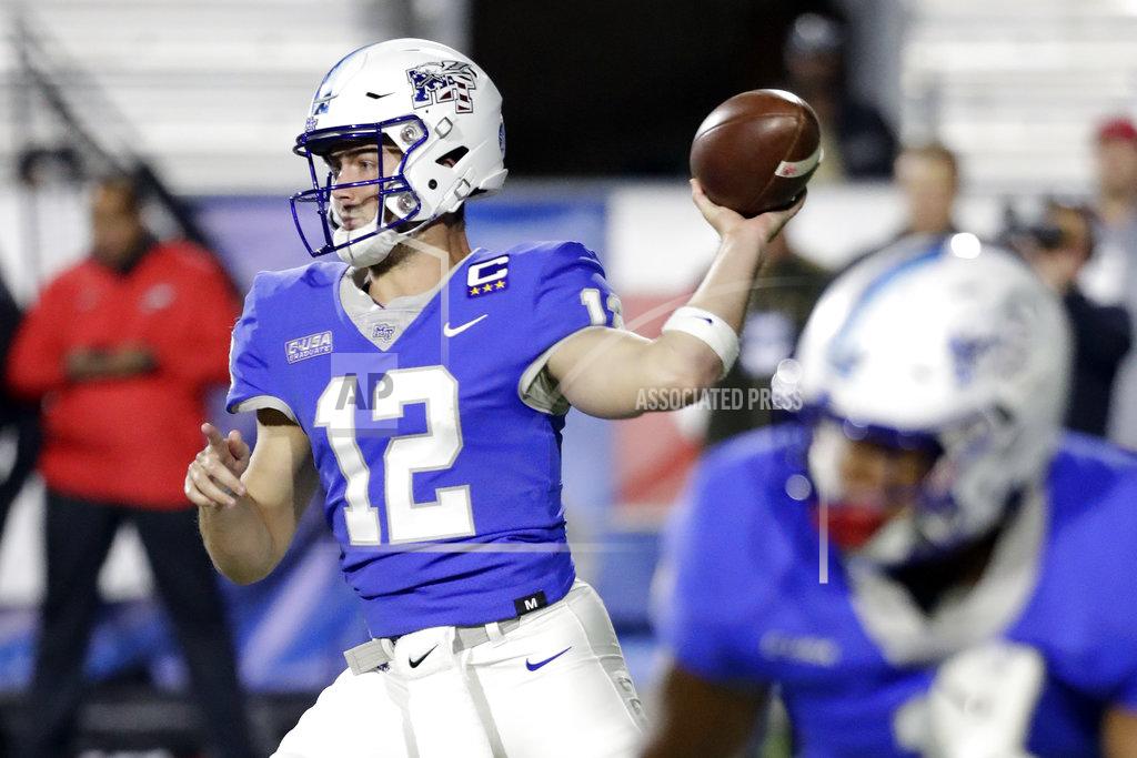 Mark Humphrey Middle Tennessee quarterback Brent Stockstill (12) passes against Western Kentucky in the first half of an NCAA college football game Friday, Nov. 2, 2018, in Murfreesboro, Tenn. (AP Photo/Mark Humphrey)