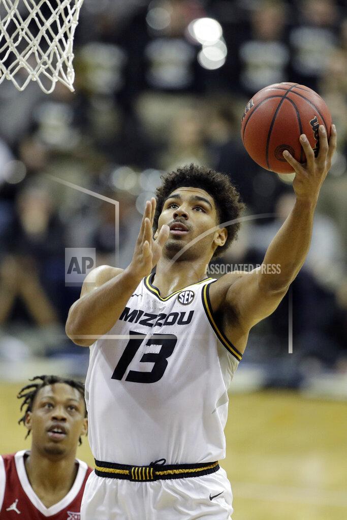 Charlie Riedel Missouri guard Mark Smith (13) shoots during the first half of an NCAA college basketball game against Oklahoma, Tuesday, Nov. 26, 2019, in Kansas City, Mo. (AP Photo/Charlie Riedel)