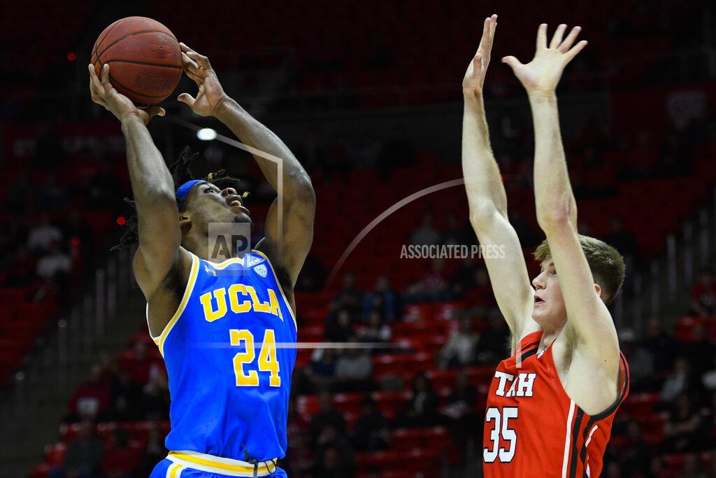 Alex Goodlett UCLA forward Jalen Hill (24) shoots over Utah center Branden Carlson (35) during the first half of an NCAA college basketball game Thursday, Feb. 20, 2020, in Salt Lake City. (AP Photo/Alex Goodlett)