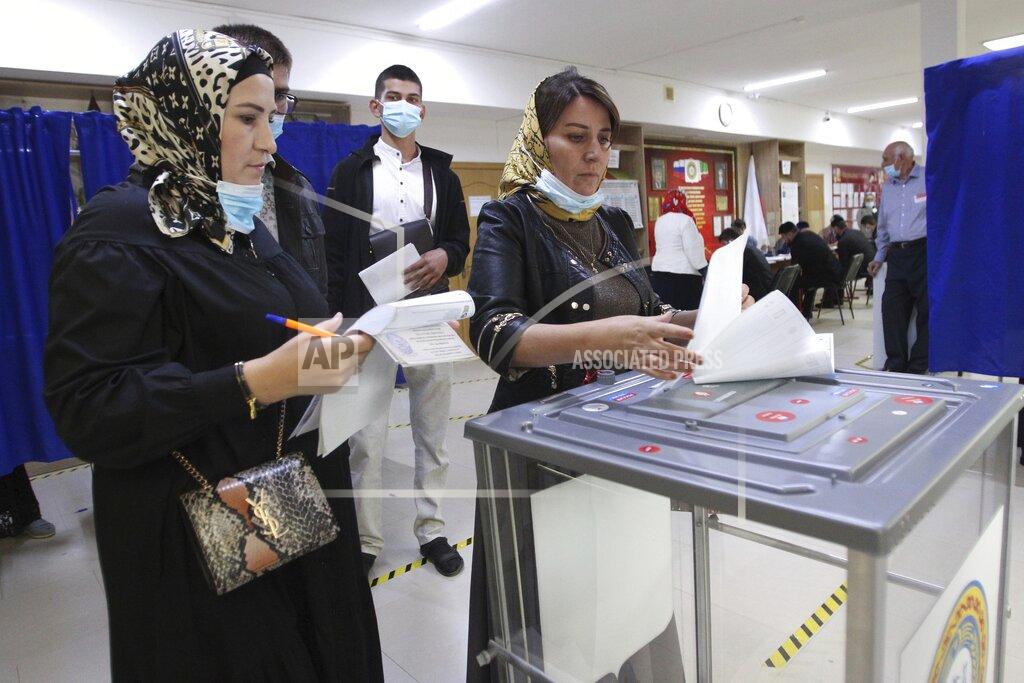 Musa Sadulayev Chechen women cast their ballots at a polling station during the Parliamentary elections in Grozny, Russia, Friday, Sept. 17, 2021. Russia has begun three days of voting for a new parliament that is unlikely to change the country's political complexion. There's no expectation that United Russia, the party devoted to President Vladimir Putin, will lose its dominance in the State Duma. (AP Photo/Musa Sadulayev)