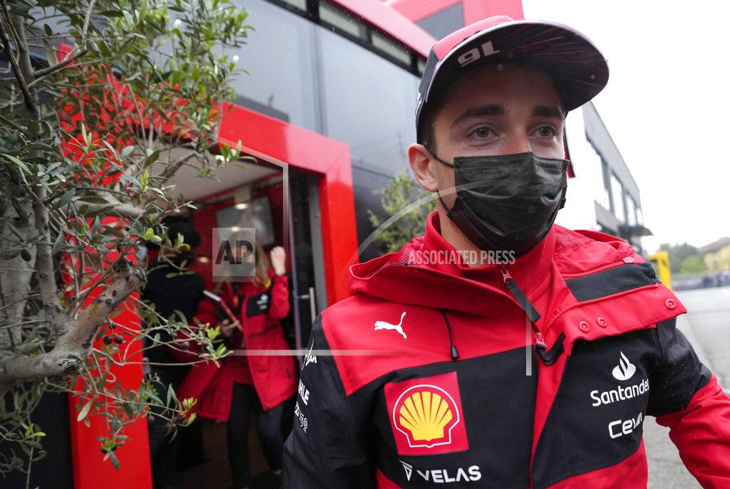 Luca Bruno Ferrari driver Charles Leclerc of Monaco arrives in the paddock at the Dino and Enzo Ferrari racetrack, in Imola, Italy, Thursday, April 21, 2022. Italy's Emila Romagna Formula One Grand Prix will take place on Sunday. (AP Photo/Luca Bruno)