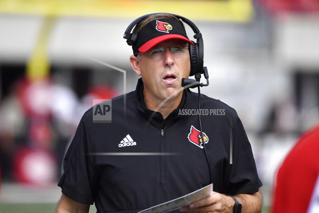 Timothy D. Easley Louisville head coach Scott Satterfield talks on his headset during the second half of an NCAA college football game against South Florida in Louisville, Ky., Saturday, Sept. 24, 2022. Louisville won 41-3. (AP Photo/Timothy D. Easley)