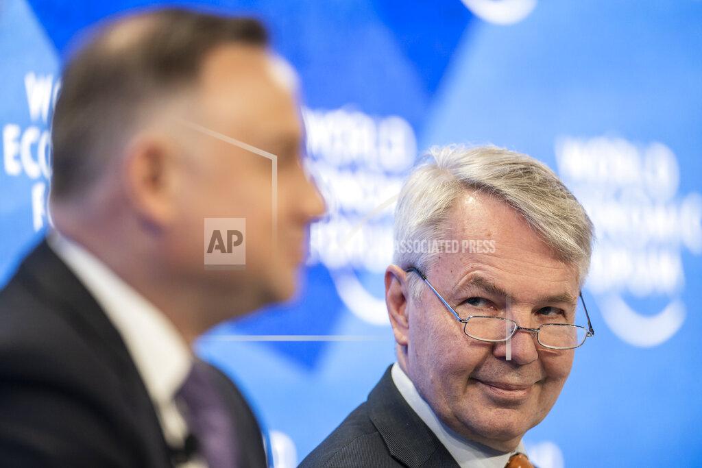Gian Ehrenzeller Pekka Haavisto, Minister for Foreign Affairs of Finland of Finland, right, and Andrzej Duda, President of Poland address a panel session during the 51st annual meeting of the World Economic Forum, WEF, in Davos, Switzerland, on Tuesday, May 24, 2022. The forum has been postponed due to the Covid-19 outbreak and was rescheduled to early summer. The meeting brings together entrepreneurs, scientists, corporate and political leaders in Davos under the topic "History at a Turning Point: Government Policies and Business Strategies" from 22 - 26 May 2022. (Gian Ehrenzeller/Keystone via AP)