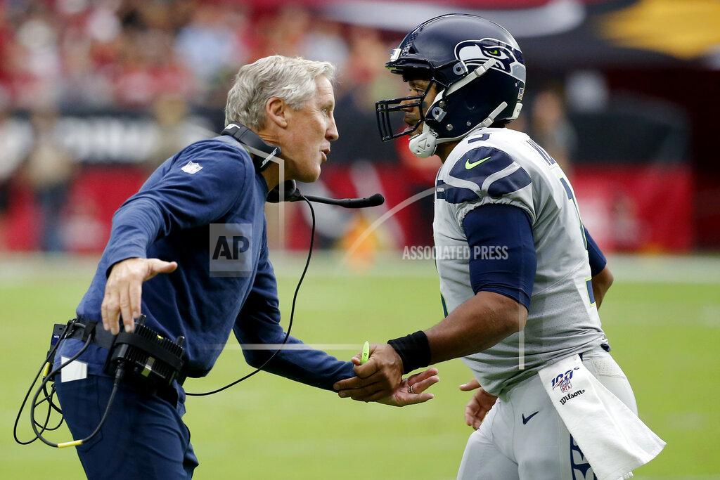 Rick Scuteri Seattle Seahawks head coach Pete Carroll greets Russell Wilson after a touchdown pass during the first half of an NFL football game against the Arizona Cardinals, Sunday, Sept. 29, 2019, in Glendale, Ariz. (AP Photo/Rick Scuteri)