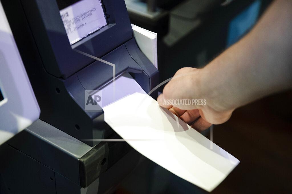 FILE—In this June 13, 2019 file photo, an Investigator with the Office of the City Commissioners, demonstrates the ExpressVote XL voting machine at the Reading Terminal Market in Philadelphia. As the Nov. 3 2020 presidential vote nears, there are fresh signs that the nation’s electoral system is again under attack from foreign adversaries.
Intelligence officials confirmed in recent days that foreign actors are actively seeking to compromise the private communications of “U.S. political campaigns, candidates and other political targets” while working to compromise the nation's election infrastructure. (AP Photo/Matt Rourke, File)