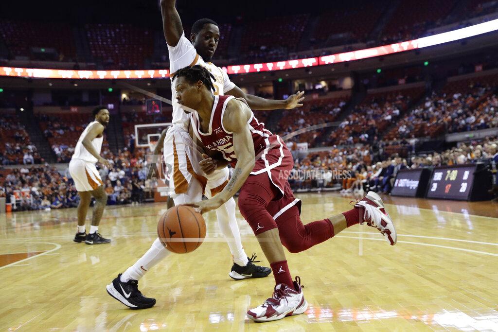 Eric Gay Oklahoma guard Alondes Williams (15) drives around Texas guard Courtney Ramey (3) during the first half of an NCAA college basketball game in Austin, Texas, Wednesday, Jan. 8, 2020. (AP Photo/Eric Gay)