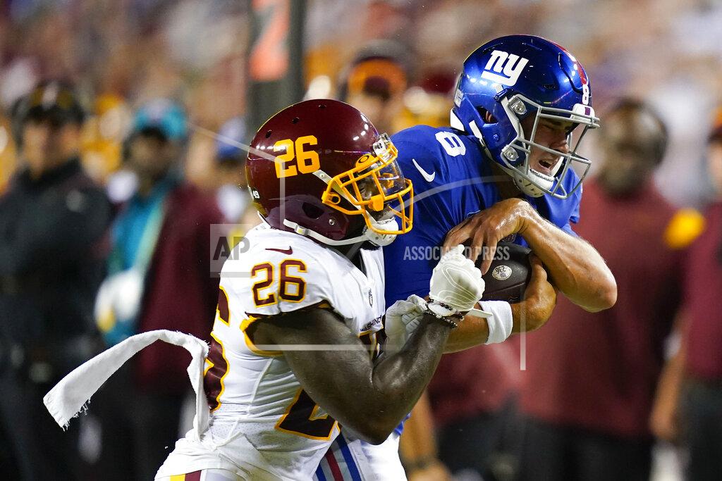 Patrick Semansky New York Giants quarterback Daniel Jones (8) is hit while running with the ball by Washington Football Team strong safety Landon Collins (26) during the first half of an NFL football game, Thursday, Sept. 16, 2021, in Landover, Md. (AP Photo/Patrick Semansky)