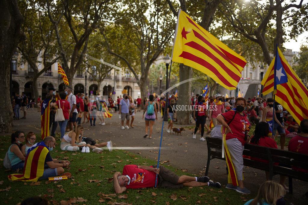 Joan Mateu Parra Pro-independence demonstrators rest in a park after taking part at a demonstration during the Catalan National Day in Barcelona, Spain, Saturday, Sept. 11, 2021. Thousands of Catalans have rallied for independence from the rest of Spain in their first major mass gathering since the start of the pandemic. The march in Barcelona on Saturday comes before a meeting between regional leaders in northeast Catalonia and the Spanish government. ( AP Photo/Joan Mateu Parra)