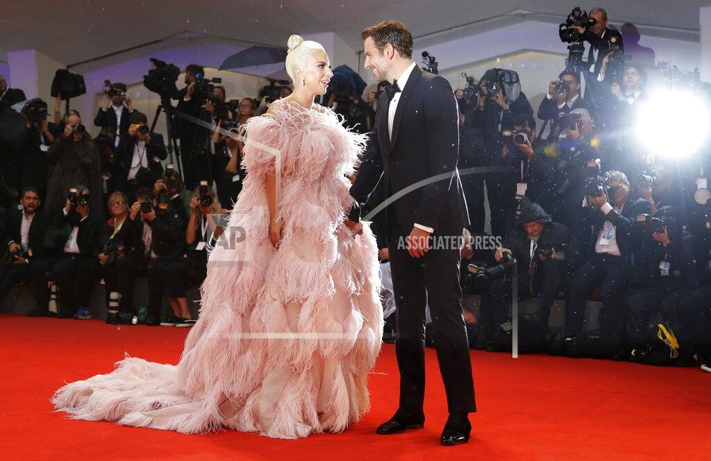 Kirsty Wigglesworth File - Actors Lady Gaga, left, and Bradley Cooper pose for photographers upon arrival at the premiere of the film 'A Star Is Born' at the Venice Film Festival. The 77th Venice Film Festival will kick off on Wednesday, Sept. 2, 2020, but this year's edition will be unlike any others. Coronavirus restrictions will mean fewer Hollywood stars, no crowds interacting with actors and other virus safeguards will be deployed. (AP Photo/Kirsty Wigglesworth, File)