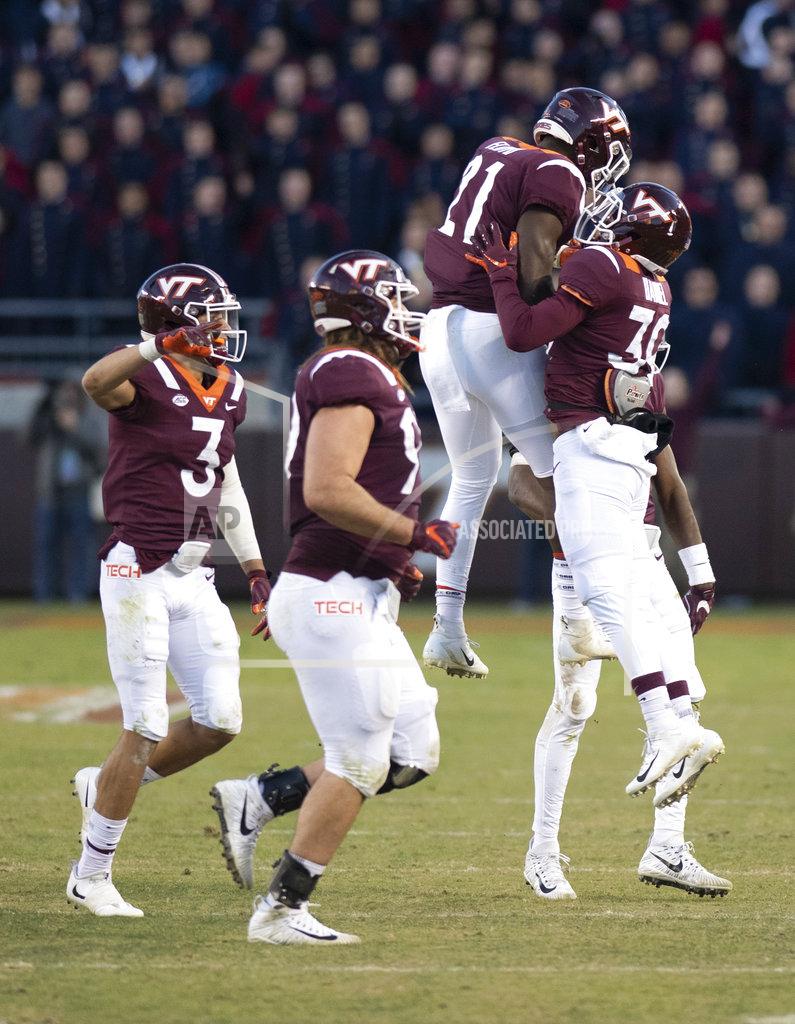 Matt Bell Virginia Tech celebrates a turnover on downs that was overturned after review during an NCAA college football game against Boston College in Blacksburg, Va., Saturday, Nov. 3, 2018. (AP Photo/Matt Bell)