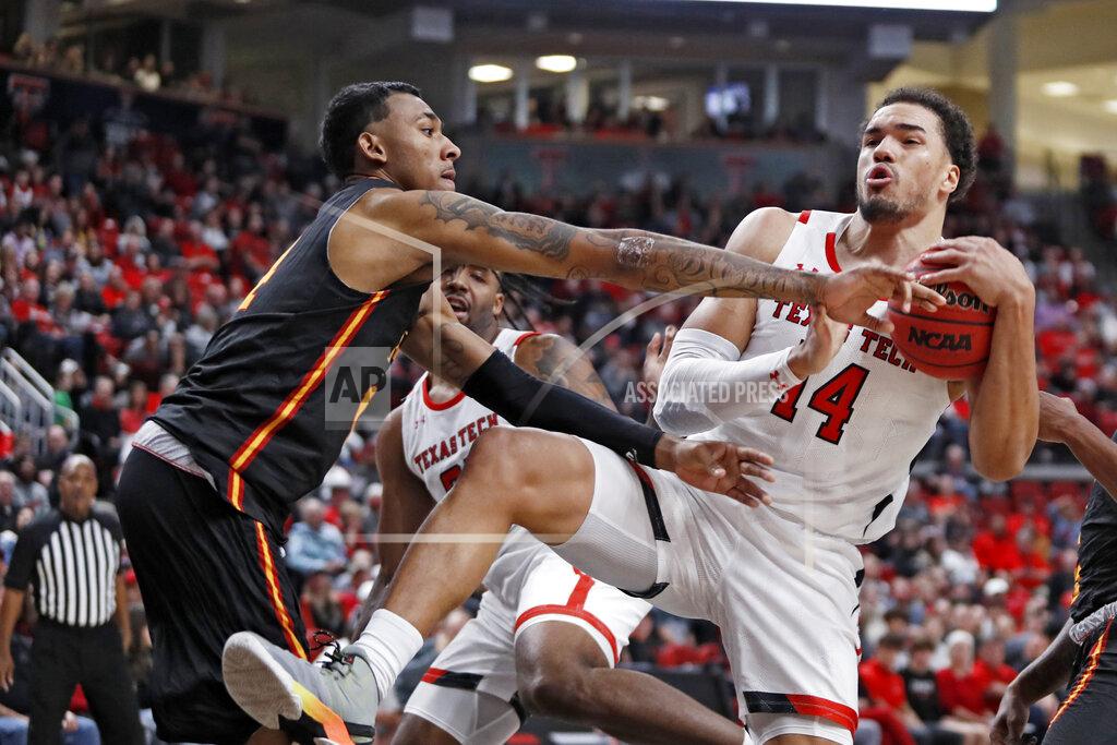 Brad Tollefson Texas Tech's Marcus Santos-Silva (14) rebounds the ball away from Grambling State's AJ Taylor (14) during the first half of an NCAA college basketball game against Grambling State, Friday, Nov. 12, 2021, in Lubbock, Texas. (Brad Tollefson/Lubbock Avalanche-Journal via AP)