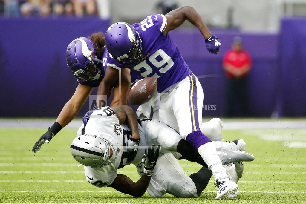 Bruce Kluckhohn Oakland Raiders tight end Darren Waller fumbles after getting hit by Minnesota Vikings defenders Xavier Rhodes (29) and Eric Kendricks, rear, during the second half of an NFL football game, Sunday, Sept. 22, 2019, in Minneapolis. (AP Photo/Bruce Kluckhohn)