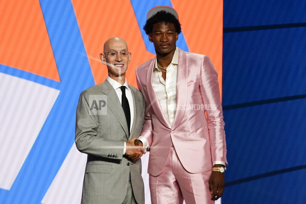 Corey Sipkin Kai Jones poses for a photo with NBA Commissioner Adam Silver after being selected as the 19th overall pick by the New York Knicks during the NBA basketball draft, Thursday, July 29, 2021, in New York. (AP Photo/Corey Sipkin)