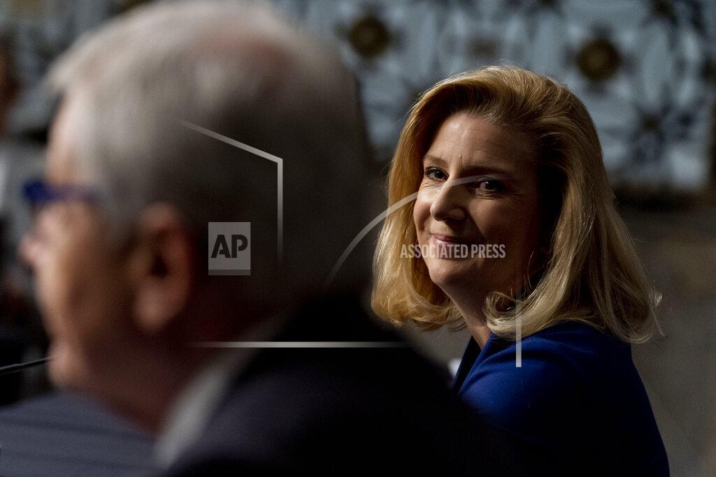 Andrew Harnik Nominee to be Secretary of the Army Christine Elizabeth Wormuth smiles as former Secretary of Defense Chuck Hagel, left, introduces her during a Senate Armed Services Committee nomination hearing on Capitol Hill in Washington, Thursday, May 13, 2021. (AP Photo/Andrew Harnik)
