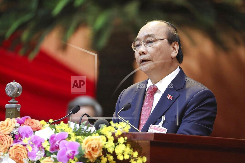 Bui Lam Khanh Vietnam Prime Minister Nguyen Xuan Phuc delivers a speech during the opening of 13th Communist Party Congress in Hanoi, Vietnam on Tuesday, Jan. 26, 2021. Vietnam's ruling Communist Party has begun a crucial weeklong meeting in the capital Hanoi to set the nation's path for the next five years and appoint the country's top leaders. (Bui Doan Tan/VNA via AP)
