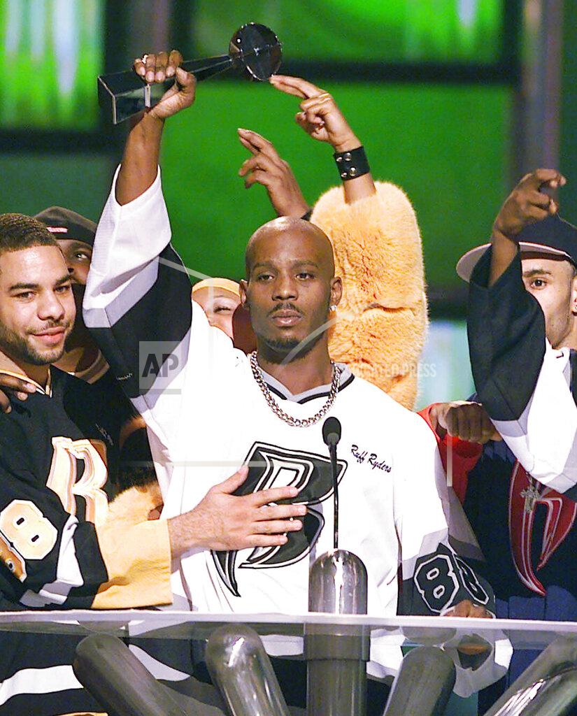Laura Rauch FILE - DMX, center, accepts the R&B Album Artist of the Year during the 1999 Billboard Music Awards in Las Vegas, on Dec. 8, 1999. The family of rapper DMX says he has died at age 50 after a career in which he delivered iconic hip-hop songs such as “Ruff Ryders’ Anthem." A statement from the family says the Grammy-nominated rapper died at a hospital in White Plains, New York, "with his family by his side after being placed on life support for the past few days. He was rushed to a New York hospital from his home April 2. (AP Photo/Laura Rauch, File)