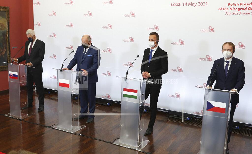 Czarek Sokolowski Slovak Foreign Minister Ivan Korcok, left, Polish Foreign Minister Zbigniew Rau, Hungarian Foreign Minister Peter Szijjarto and Czech Republic Foreign Minister Tomas Petricek,right, during a press conference after the foreign ministers of the Visegrad Group ,V4, in Lodz, Poland, Friday, May 14, 2021.( AP Photo/Czarek Sokolowski)