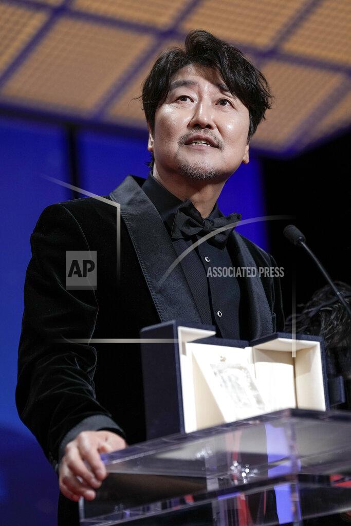 Joel C Ryan Song Kang-ho accepts the award for best actor for 'Broker' during the awards ceremony of the 75th international film festival, Cannes, southern France, Saturday, May 28, 2022. (Photo by Joel C Ryan/Invision/AP)
