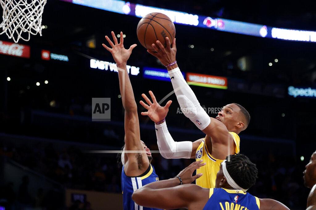Ringo H.W. Chiu Los Angeles Lakers guard Russell Westbrook shoots as Golden State Warriors guard Moses Moody, rear, defends during the first half of an NBA basketball game in Los Angeles, Tuesday, Oct. 19, 2021. (AP Photo/Ringo H.W. Chiu)