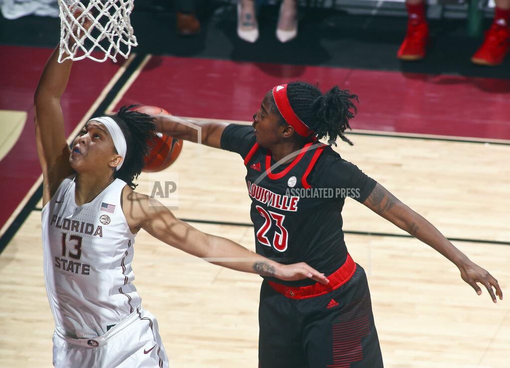 Phil Sears Florida State guard Nausia Woolfolk (13) has her layup rejected by Louisville guard Jazmine Jones (23) during the first half of an NCAA college basketball game in Tallahassee, Fla., Thursday, Jan. 24, 2019. (AP Photo/Phil Sears)