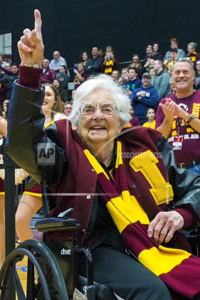 Tyler Lariviere FILE - In this March 25, 2018, file photo, Sister Jean Dolores-Schmidt, chaplain of the Loyola-Chicago basketball team, gestures during a rally for the team in Chicago. One of the lasting memories of the 2018 tournament was the Ramblers' telegenic now-100-year-old team chaplain, Sister Jean Dolores-Schmidt. What they did on the court was pretty memorable, too. (Tyler LaRiviere/Chicago Sun-Times via AP, File)