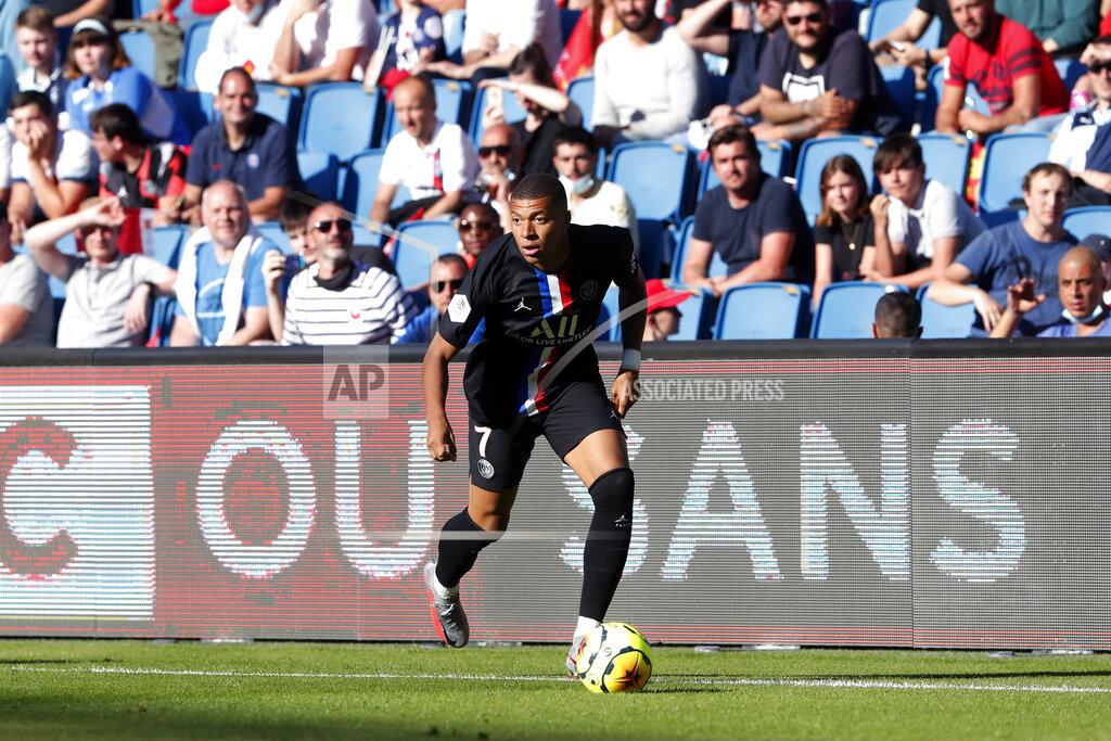 Paris Saint Germain's Kylian Mbappe controls the ball during a friendly soccer match between Paris Saint Germain and Le Havre, in Le Havre, western France, Sunday, July 12, 2020. (AP Photo/Thibault Camus)