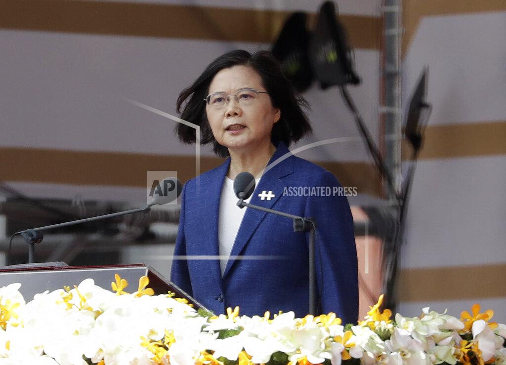 Chiang Ying-Ying FILE - In this Oct. 10, 2021, file photo, Taiwanese President Tsai Ing-wen delivers a speech during National Day celebrations in front of the Presidential Building in Taipei, Taiwan. After sending a record number of military aircraft to harass Taiwan over China’s National Day holiday weekend, Beijing has toned down the sabre rattling but tensions remain high, with the rhetoric and reasoning behind the exercises unchanged. (AP Photo/Chiang Ying-ying, File)