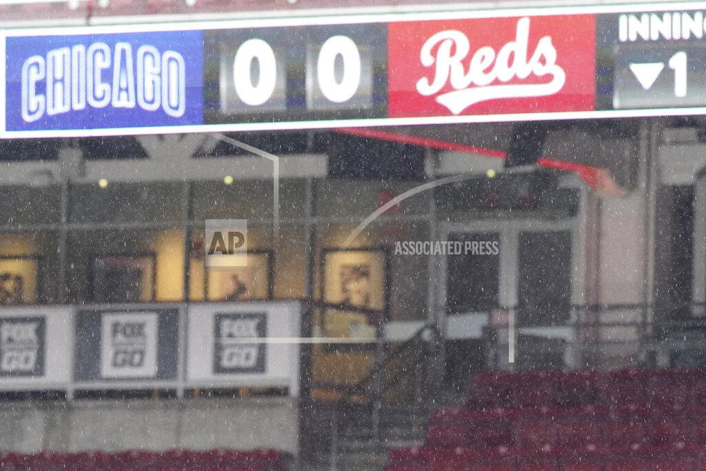 Bryan Woolston Rain falls during a rain delay prior to a baseball game between the Cincinnati Reds and the Chicago Cubs at Great American Ballpark in Cincinnati, Thursday, July 30, 2020. (AP Photo/Bryan Woolston)