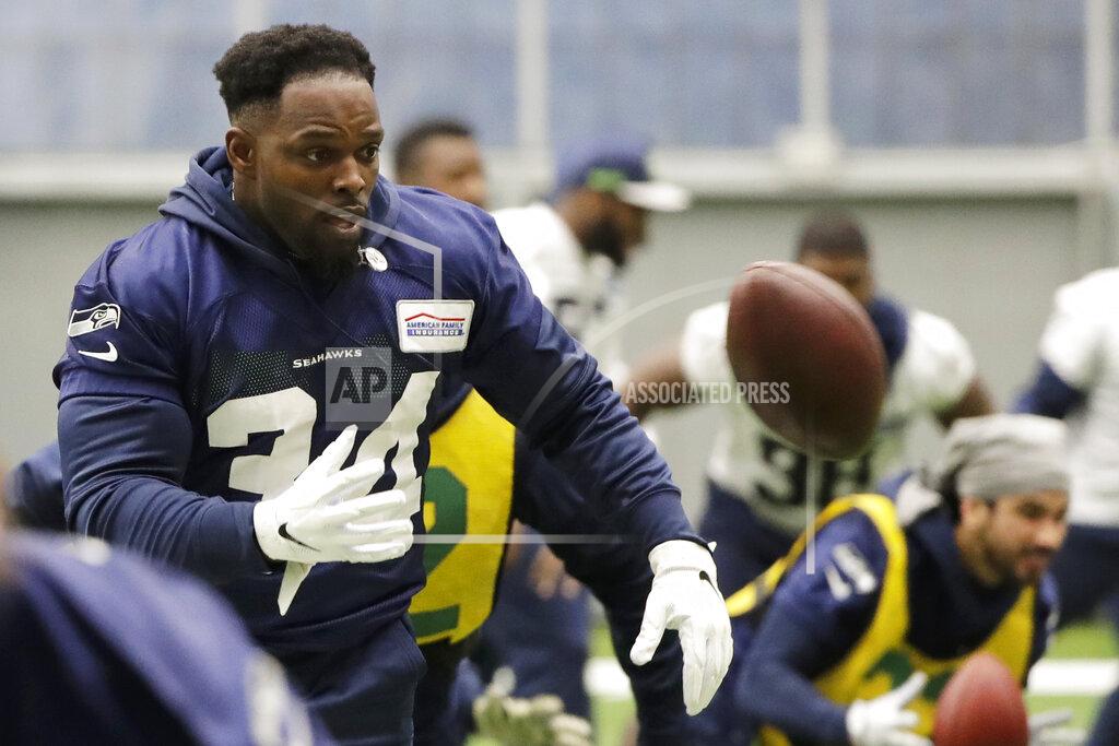 Ted S. Warren Seattle Seahawks running back Robert Turbin tosses a football as he warms up before NFL football practice, Friday, Dec. 27, 2019, in Renton, Wash. (AP Photo/Ted S. Warren)