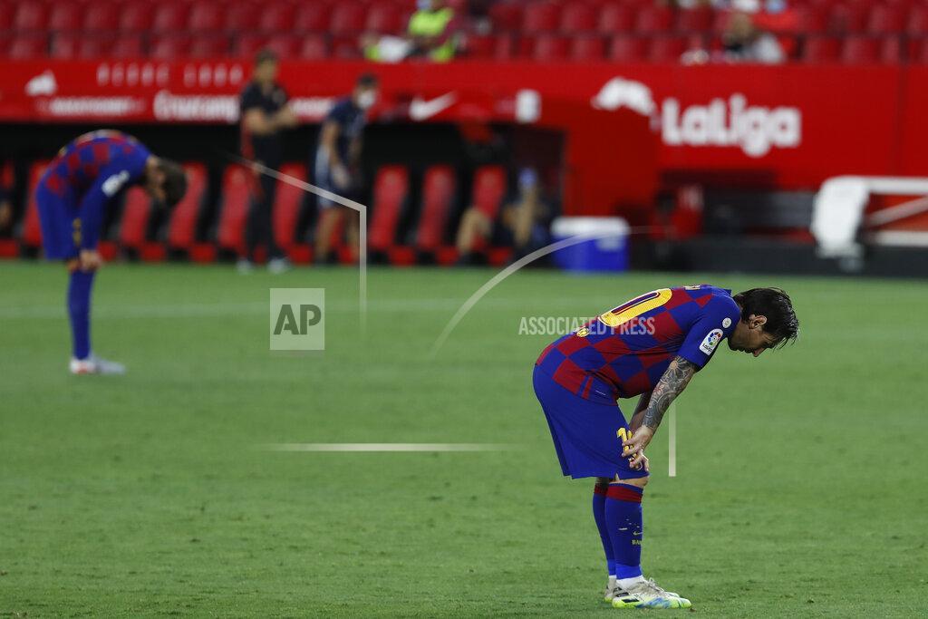 Angel Fernandez Barcelona's Lionel Messi reacts during the Spanish La Liga soccer match between Sevilla and FC Barcelona at the Ramon Sanchez-Pizjuan stadium in Seville, Spain, Friday, June 19, 2020. (AP Photo/Angel Fernandez)
