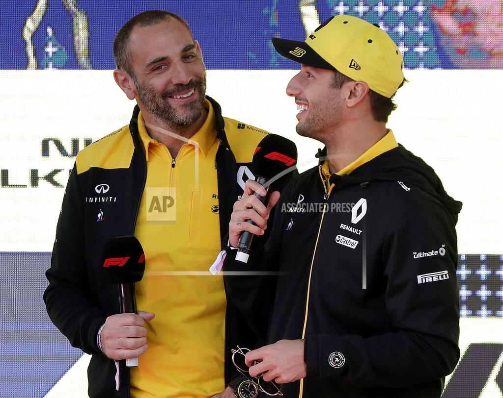 Rick Rycroft Renault driver Daniel Ricciardo of Australia, right, talks as team principal Cyril Abiteboul listens during the launch for the Australian Grand Prix in Melbourne, Australia, Wednesday, March 13, 2019. (AP Photo/Rick Rycroft)