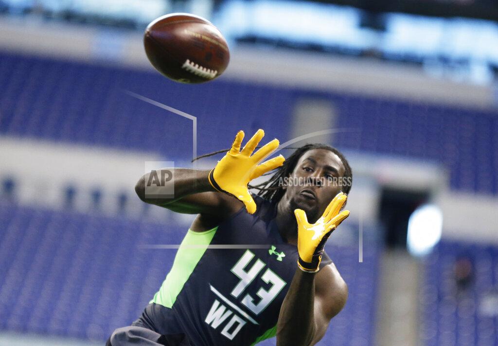 Michael Conroy FILE - In this Feb. 27, 2016, file photo, Mississippi State receiver De'Runnya Wilson runs a drill at the NFL football scouting combine in Indianapolis. Authorities say the death of Wilson, a former Mississippi State football player whose body was found in an Alabama home Tuesday, Jan. 21, 2020, is being investigated as a homicide. (AP Photo/Michael Conroy, File)