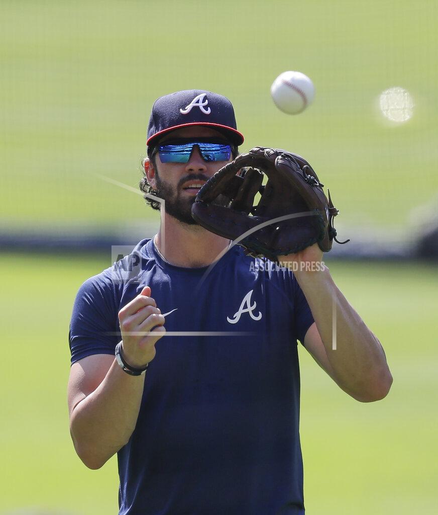 Brynn Anderson Atlanta Braves' Dansby Swanson catches a ball during team practice at Truist Park on Sunday, July 5, 2020, in Atlanta. (AP Photo/Brynn Anderson)