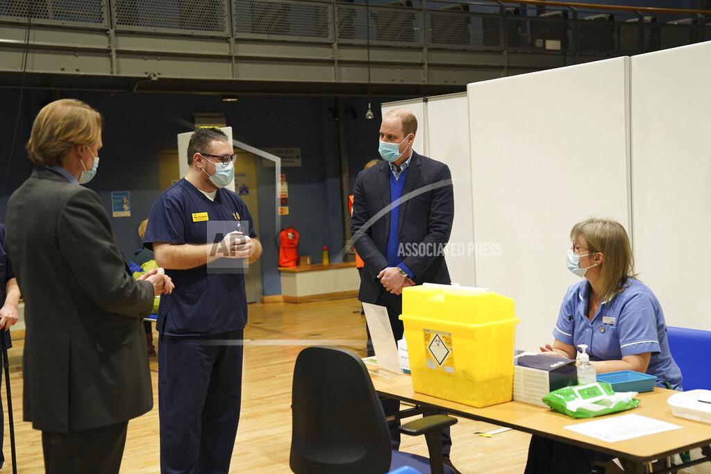Arthur Edwards Britain's Prince William, center, speaks to staff and volunteers during his visit to the King's Lynn Corn Exchange Vaccination Centre in King's Lynn, Monday Feb. 22, 2021. (Arthur Edwards/Pool via AP)