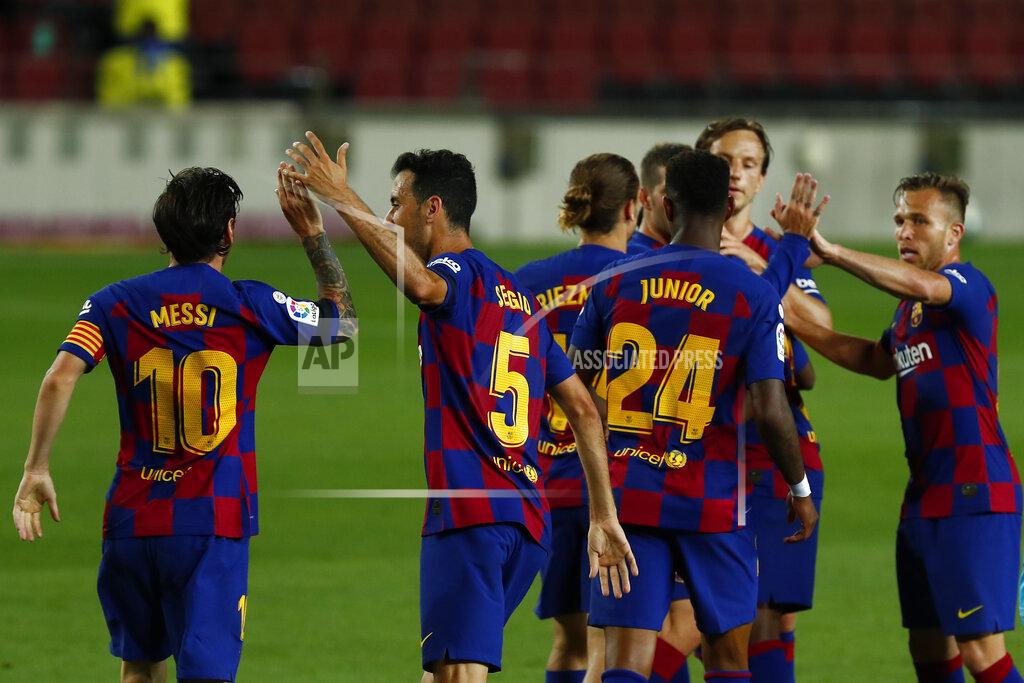 Joan Monfort Barcelona's players celebrate Ansu Fati's goal during the Spanish La Liga soccer match between FC Barcelona and Leganes at the Camp Nou stadium in Barcelona, Spain, Tuesday, June 16, 2020. (AP Photo/Joan Montfort)