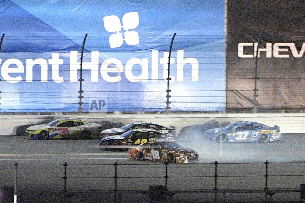 Phelan M. Ebenhack Kyle Busch (18) spins on the backstretch during the first of two qualifying races for the NASCAR Daytona 500 auto race at Daytona International Speedway Thursday, Feb. 14, 2019, in Daytona Beach, Fla. (AP Photo/Phelan M. Ebenhack)