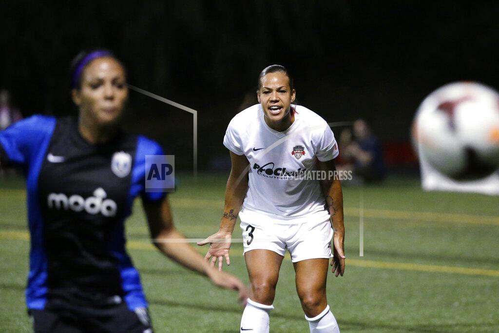 Elaine Thompson FILE - In this Aug. 24, 2014, file photo, Washington Spirit's Toni Pressley (3) yells as Seattle Reign FC's Sydney Leroux follows the ball during the first half of a NWSL semifinal soccer match in Seattle. Pressley was looking forward to a comeback season with the Orlando Pride this year after overcoming breast cancer. But then life threw the veteran defender another curve with the coronavirus pandemic and the impact it would ultimately have on the Pride, who were left out of this summer's Challenge Cup tournament. (AP Photo/Elaine Thompson, File)