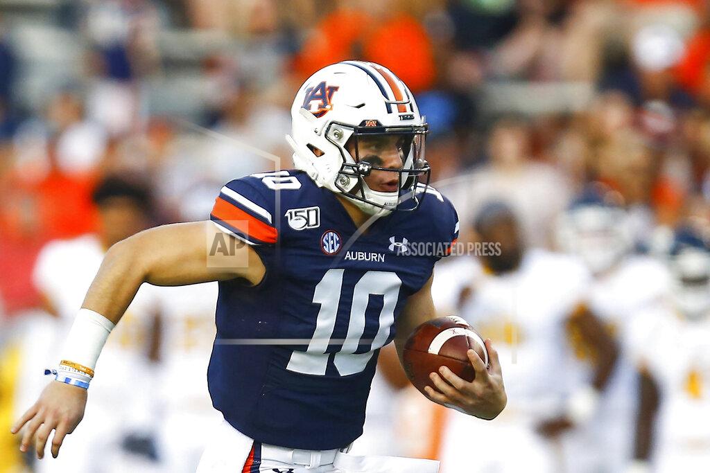 Butch Dill FILE - In this Sept. 14, 2019, file photo, Auburn quarterback Bo Nix (10) carries the ball during the first half of an NCAA college football game against Kent State, in Auburn, Ala. With a collective seven career starts between them, No. 7 Auburn's quarterback Bo Nix and No. 10 Florida's Kyle Trask are set to face off in a Top 10 showdown. (AP Photo/Butch Dill, File)