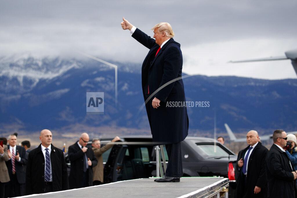 Evan Vucci FILE - In this Nov. 3, 2018, file photo President Donald Trump arrives for a campaign rally at Bozeman Yellowstone International Airport in Belgrade, Mont. If approved by Congress and signed by Trump, the Great American Outdoors Act would be the most significant conservation legislation enacted in nearly half a century. The bill, set for a Senate vote this coming week, would spend about $2.8 billion per year on conservation, outdoor recreation and park maintenance. (AP Photo/Evan Vucci, File)