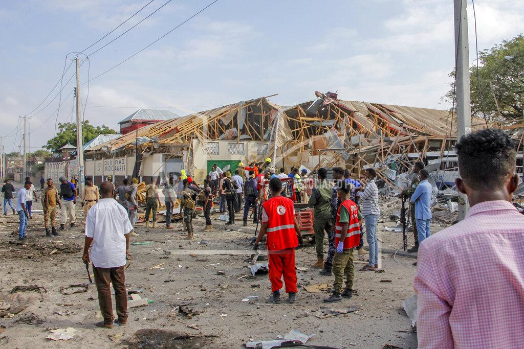 Farah Abdi Warsameh Security forces and rescue workers search for bodies at the scene of a blast in Mogadishu, Somalia Thursday, Nov. 25, 2021. Witnesses say a large explosion has occurred in a busy part of Somalia's capital during the morning rush hour. (AP Photo/Farah Abdi Warsameh)