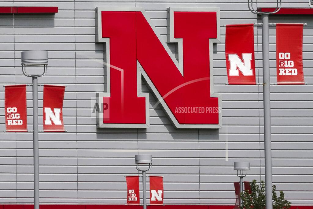 Nati Harnik The Nebraska logo and flags incorporating the Big Ten logo are seen outside the Devaney sports center in Lincoln, Neb., Tuesday, Sept. 15, 2020. (AP Photo/Nati Harnik)
