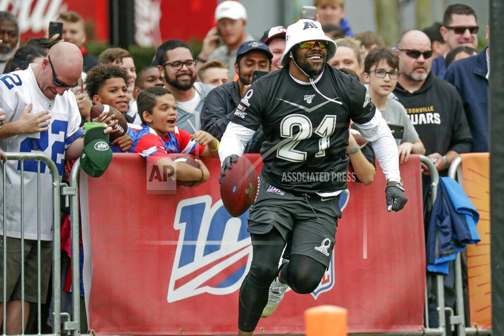AFC running back Mark Ingram, of the Baltimore Ravens (21), runs back on the field after he jumped over the railing to have some fun with fans during a practice for the NFL Pro Bowl football game Thursday, Jan. 23, 2020, in Kissimmee, Fla. (AP Photo/John Raoux)