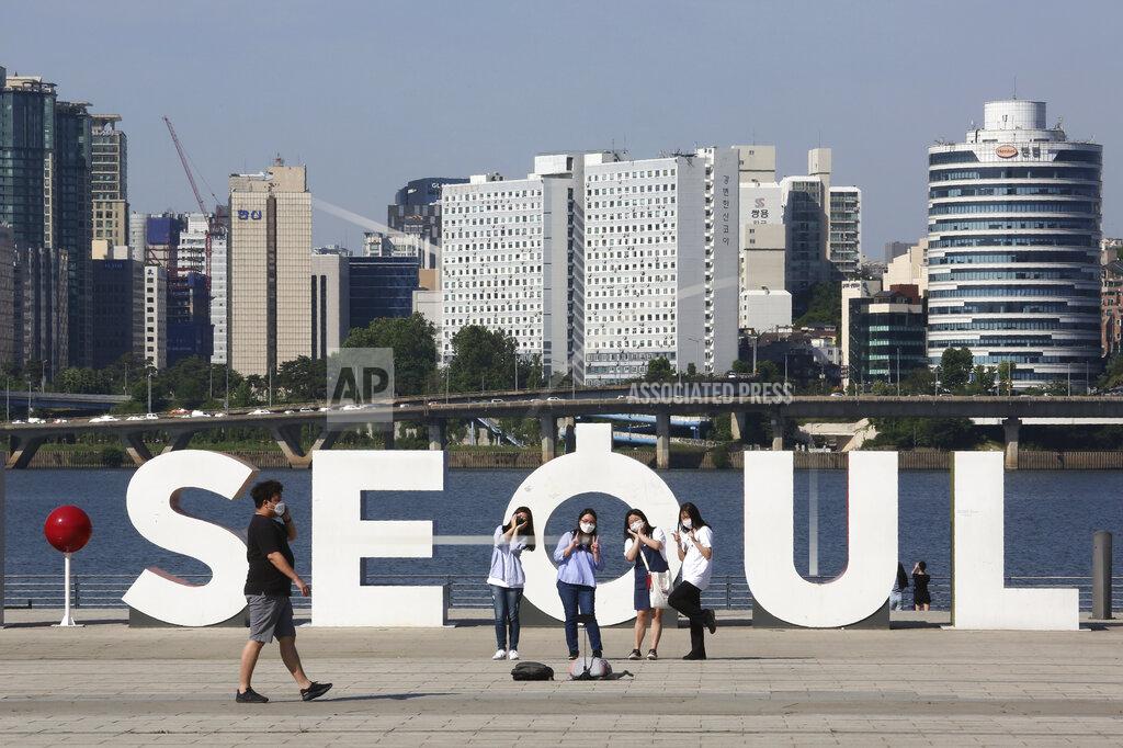 Ahn Young-Joon Women take a selfie at a park in Seoul, South Korea, Thursday, June 11, 2020. Just weeks ago South Korea was celebrating its hard-won gains against the coronavirus. It was easing social distancing measures, reopening schools and promoting its tech-driven methods of fighting the spread of the virus. But the country’s success story is being threatened by a resurgence of infections in the area around Seoul where half of South Korea’s 51 million people live. (AP Photo/Ahn Young-joon)