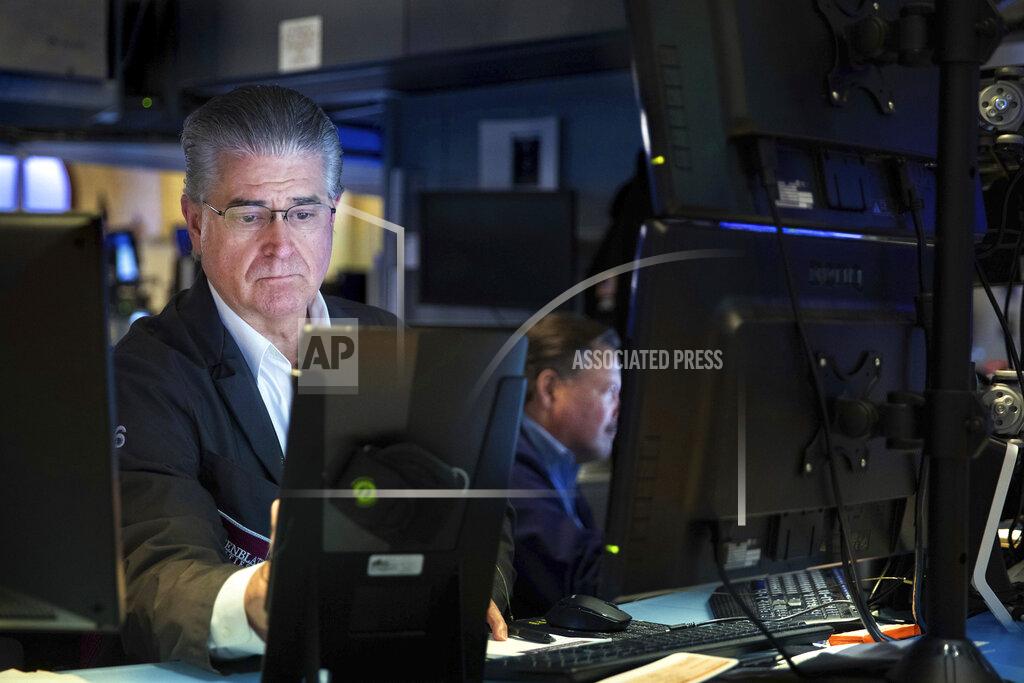 Allie Joseph In this photo provided by the New York Stock Exchange, a pair of traders work on the floor, Friday, May 20, 2022. Another drop for stocks on Friday has pushed the S&P 500 index 20% below its peak set early this year. (Allie Joseph/New York Stock Exchange via AP)