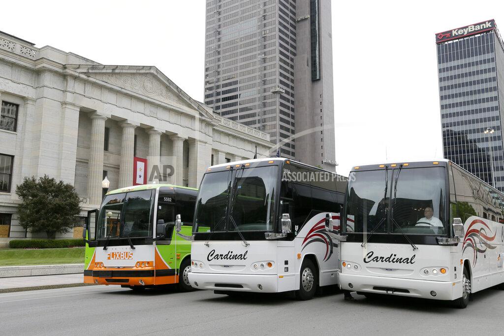 Dozens of buses surrounded the Ohio Statehouse in Columbus, Ohio, on Wednesday, June 17, 2020, in a rolling rally which was one of many taking place at state capitols around the United States as part of "Motorcoaches Rolling for Awareness." The buses eventually took all three lanes of South Third Street between Broad and State, halting southbound traffic as bus drivers sounded their vehicles horns for approximately thirty minutes. The industry which has laid off or furloughed more than 90 percent of its workforce nationally in the wake of COVID-19 is asking for federal assistance. Cardinal Transportation, a leading transportation provider in Columbus, participated in the rally. (Barbara J. Perenic/The Columbus Dispatch via AP)