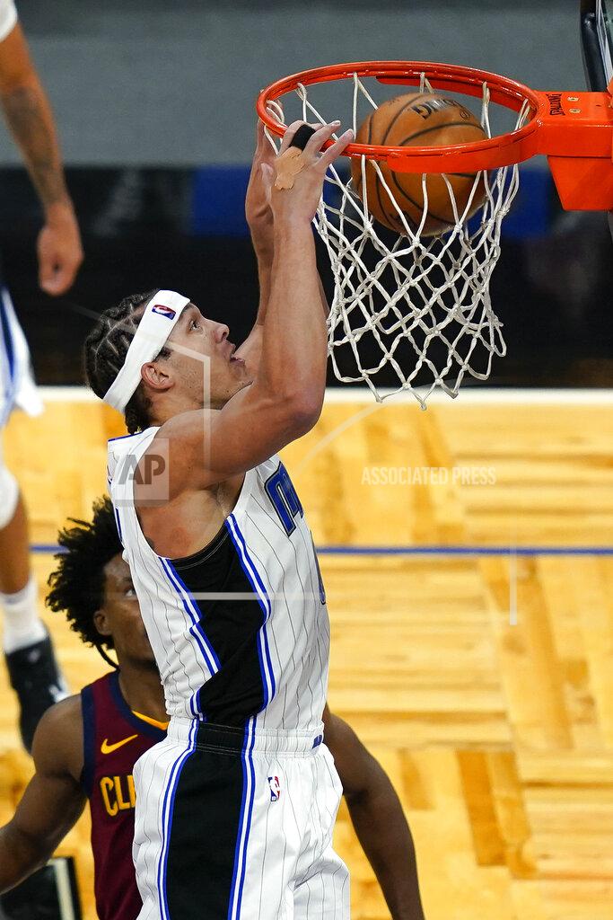 John Raoux Orlando Magic forward Aaron Gordon, front right, dunks the ball over Cleveland Cavaliers guard Collin Sexton during the second half of an NBA basketball game, Monday, Jan. 4, 2021, in Orlando, Fla. (AP Photo/John Raoux)